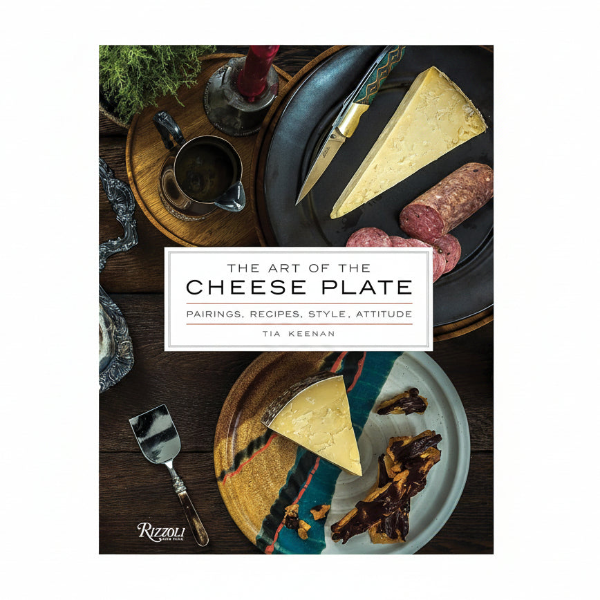 Book cover of 'The Art of the Cheese Plate' with cheese and meats on a wooden table.