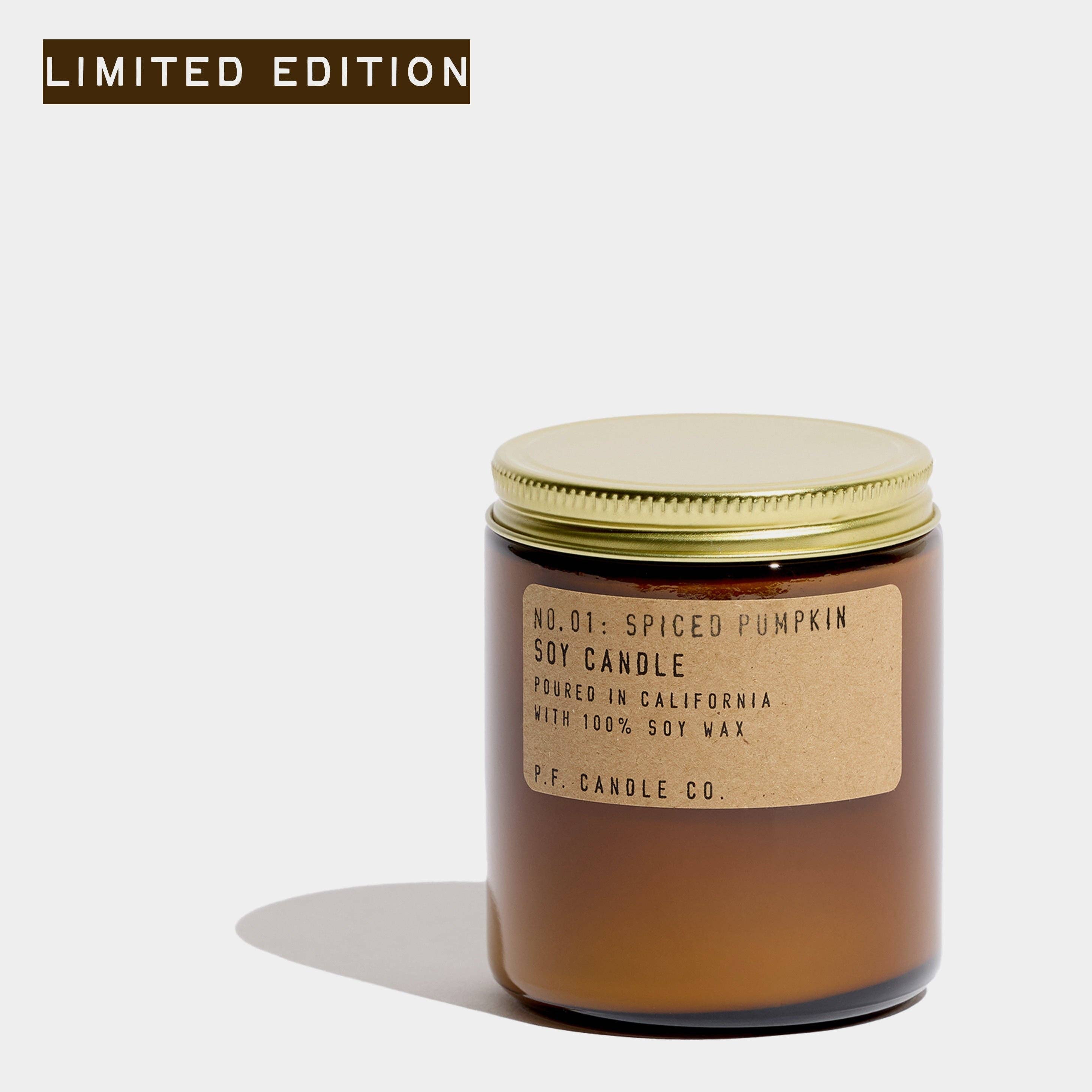 A soy candle in an amber glass jar with a gold metal lid and a kraft paper label, shown on a light gray background with a 'LIMITED EDITION' banner in the top left corner.