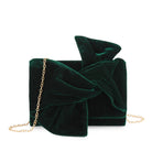 Green velvet clutch bag with a gold chain on a white background