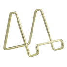 Gold metal letter 'M' on a white background
