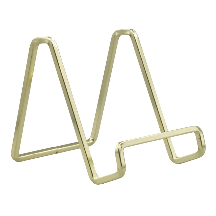 Gold metal letter 'M' on a white background