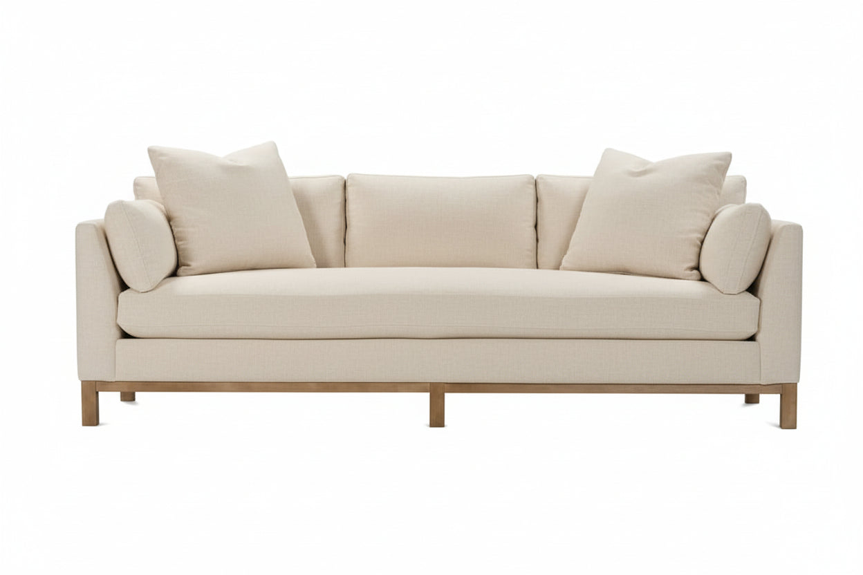 Cream sofa with wooden legs on a white background