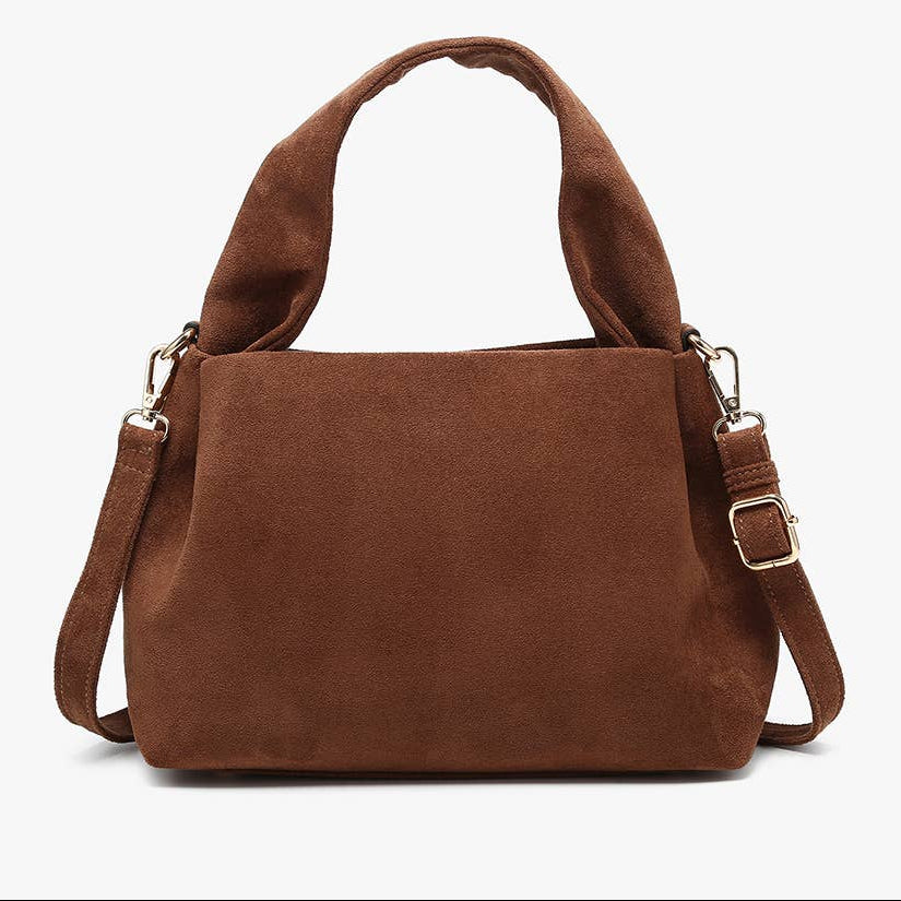 A brown suede handbag with top handles and an adjustable shoulder strap, shown against a plain white background.