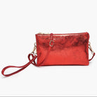 Red metallic handbag with a strap on a white background
