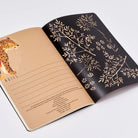 Open notebook with leopard illustration on one page and floral design on the other, on a white background.