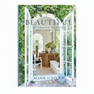 Book cover of 'Beautiful: All-American Decorating and Timeless Style' by Mark D. Sikes with a scenic view through open doors.