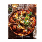Cookbook cover of 'Quick & Cozy' by Tiegham Gerard featuring a dish with meatballs and cheese.