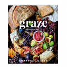 Book cover of 'Graze' by Suzanne Lenzer featuring a platter of food with bread, fruits, and cheese.
