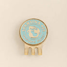 Round blue and gold object with 'Spartina 449' branding on a beige background