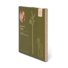 Green book titled 'here's how' with cocktail illustrations on a white background