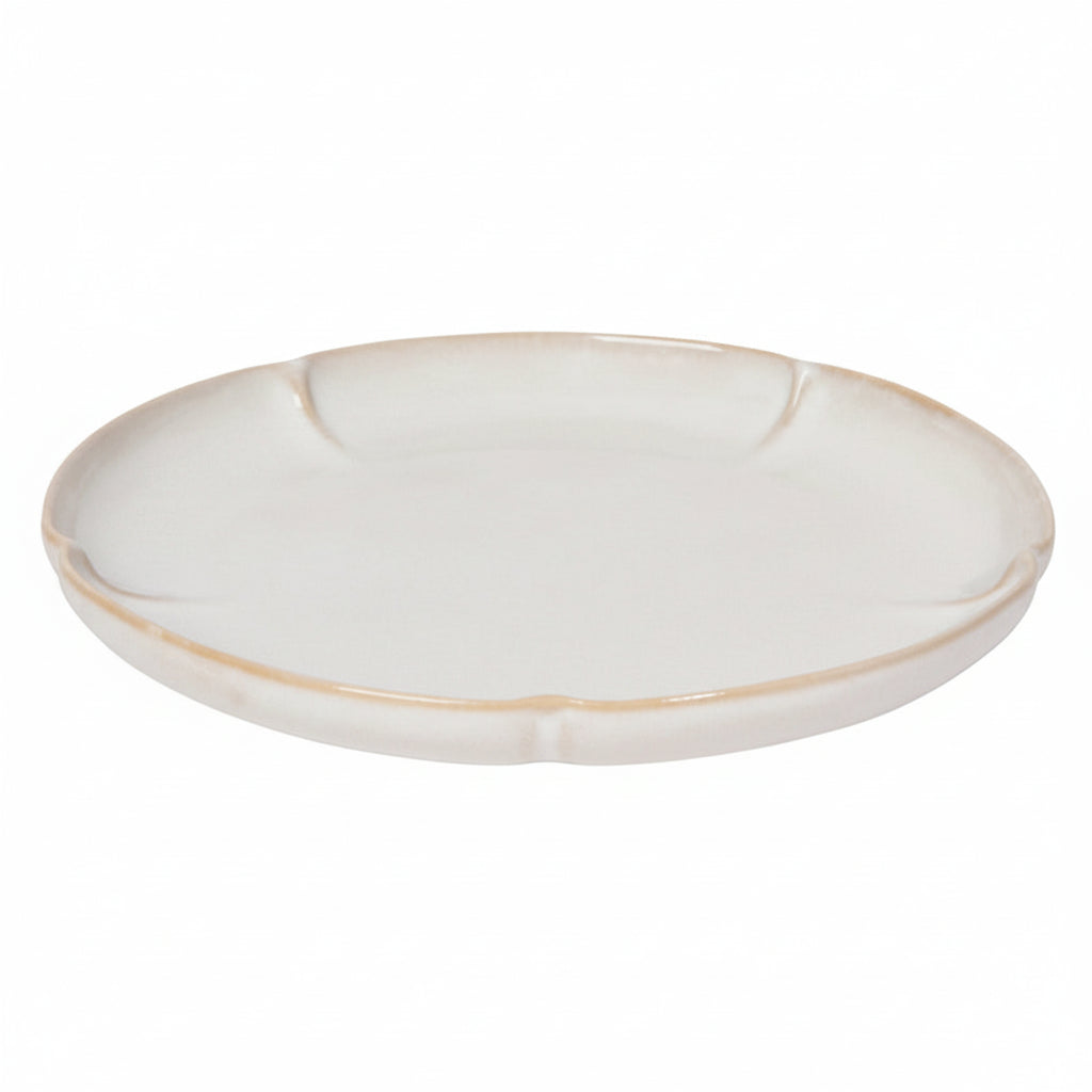 White ceramic plate with a gold rim on a white background