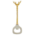 Gold deer-shaped bottle opener on a white background