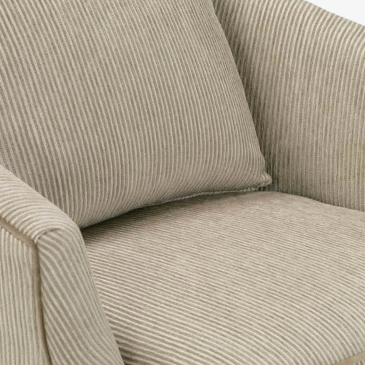 Close-up of a beige corduroy sofa with a cushion.