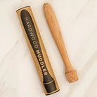 Hardwood muddler with packaging on a white background