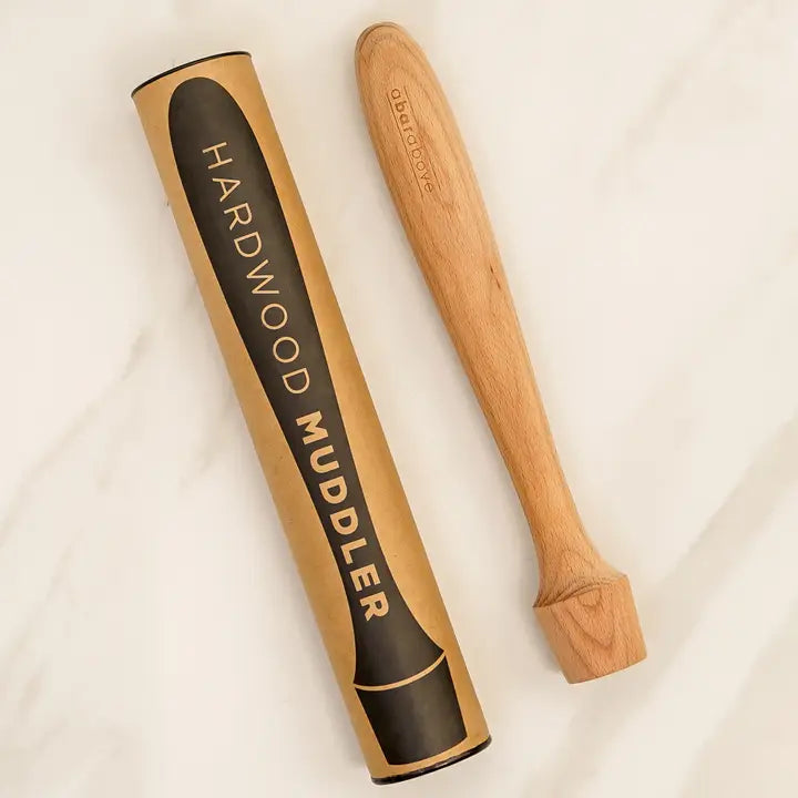 Hardwood muddler with packaging on a white background