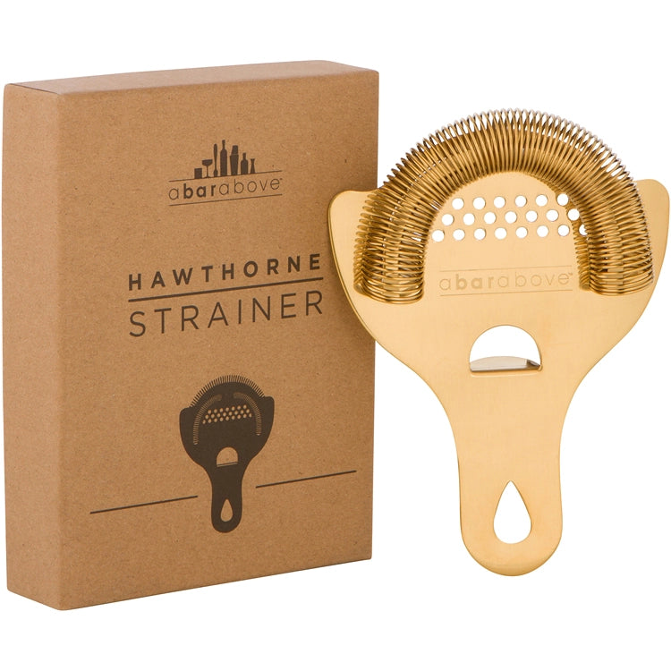 Gold Hawthorne strainer with Abarabove branding next to its packaging box.