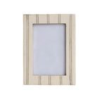 Beige striped picture frame on a white background