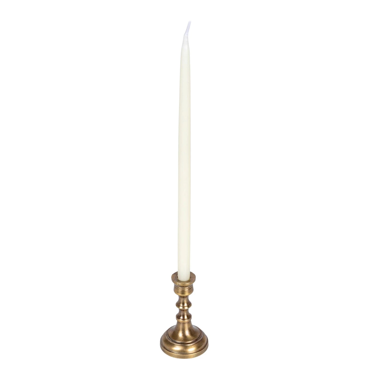 White candle on a brass candlestick against a white background