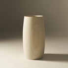 Wooden vase on a neutral background