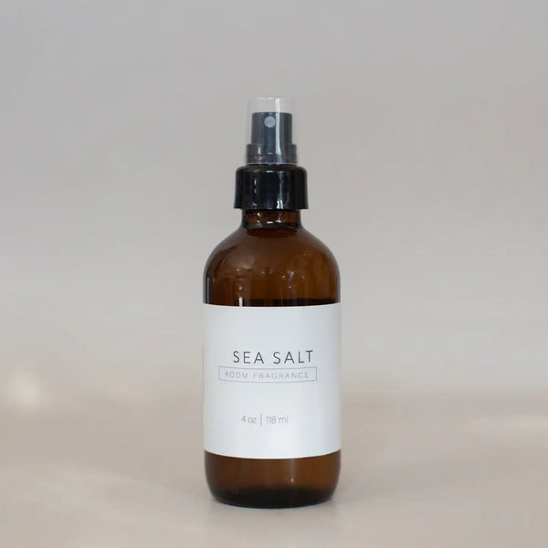 Brown spray bottle labeled 'SEA SALT' on a light gray background