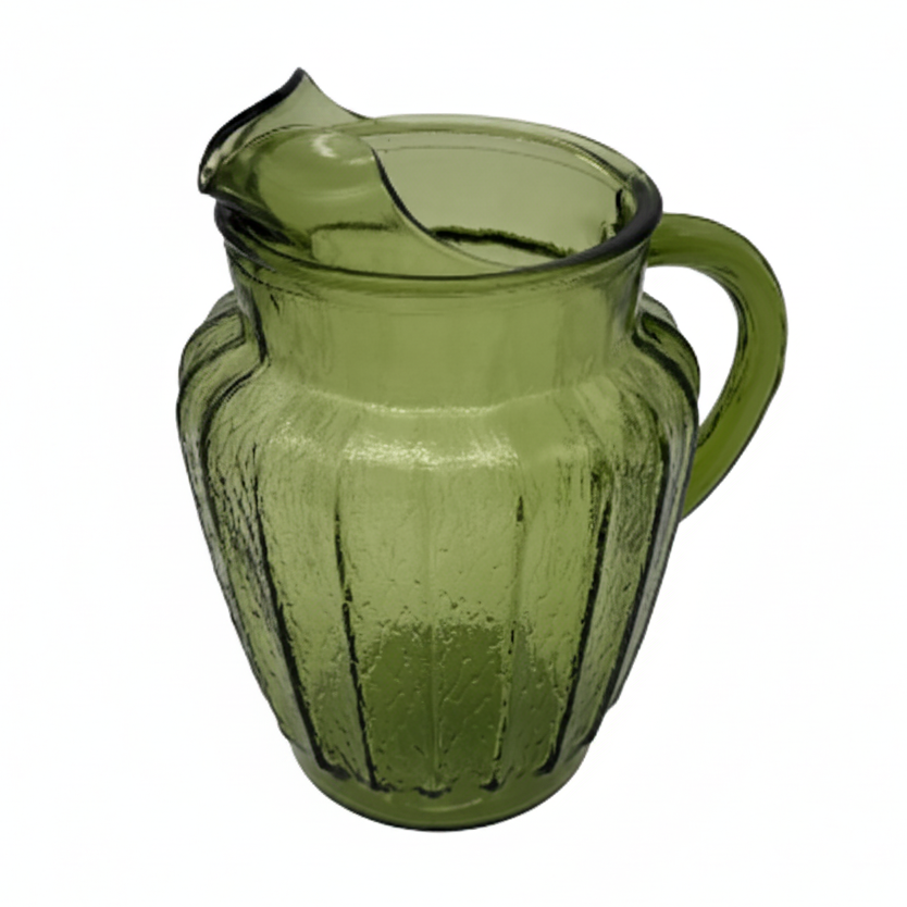 Green glass pitcher on a white background