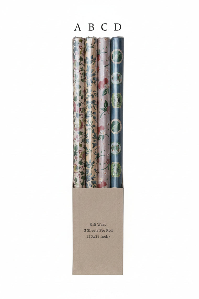 Set of four rolls of floral-patterned gift wrap in a cardboard holder on a white background.